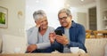 Senior couple, smartphone and social media with smile, conversation and living room sofa. Grandparents, technology and