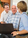 Senior couple with social worker at home Royalty Free Stock Photo