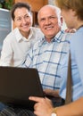 Senior couple with social worker at home Royalty Free Stock Photo