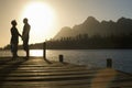 Senior Couple Standing On Edge Of Pier Royalty Free Stock Photo