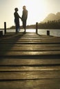 Senior Couple Standing On Edge Of Pier Royalty Free Stock Photo