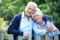 Senior couple standing by the fence Royalty Free Stock Photo