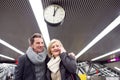 Senior couple standing at the underground platform, calling Royalty Free Stock Photo