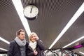 Senior couple standing at the underground platform, calling Royalty Free Stock Photo