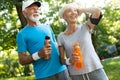 Senior couple staying hydrated after running jogging Royalty Free Stock Photo