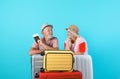 Senior couple with suitcases and passport