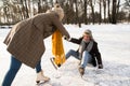 Senior couple in sunny winter nature ice skating. Royalty Free Stock Photo