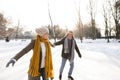 Senior couple in sunny winter nature ice skating. Royalty Free Stock Photo