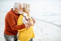 Senior couple in sweaters on the seashore Royalty Free Stock Photo