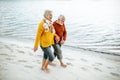 Senior couple in sweaters on the seashore Royalty Free Stock Photo