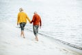 Senior couple in sweaters on the seashore Royalty Free Stock Photo