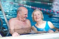 Senior couple swimming in pool Royalty Free Stock Photo