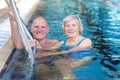 Senior couple swimming in pool Royalty Free Stock Photo