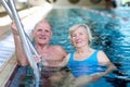 Senior couple swimming in pool Royalty Free Stock Photo