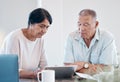 Senior couple, tablet and home of elderly people in retirement looking at web data. Digital, house research and marriage Royalty Free Stock Photo