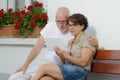 Senior couple with a tablet, outside Royalty Free Stock Photo