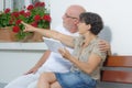 Senior couple with a tablet, outside Royalty Free Stock Photo