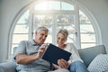 Senior couple tablet, relax smile and living room sofa for social media, email or internet video. Woman man retirement Royalty Free Stock Photo
