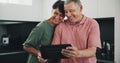 Senior couple, tablet and video call for social conversation, kitchen and lunch time. Grandparents, technology and Royalty Free Stock Photo