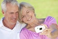 Senior Couple Take Photograph on Digital Camera Royalty Free Stock Photo