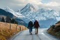A senior couple taking a brisk walk in a scenic location.