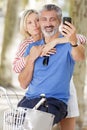 senior couple taking selfie with bikes Royalty Free Stock Photo