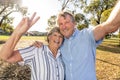 Senior couple taking selfie having fun in the park. back to life after coronavirus lockdown concept Royalty Free Stock Photo