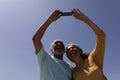 Senior couple taking selfie with mobile phone on beach Royalty Free Stock Photo