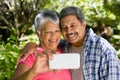 Senior couple taking selfie from mobile phone Royalty Free Stock Photo