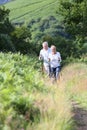 Senior couple taking a walk in mountains Royalty Free Stock Photo