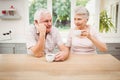 Senior couple talking to each other while having coffee Royalty Free Stock Photo
