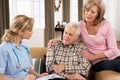 Senior Couple Talking To Health Visitor Royalty Free Stock Photo