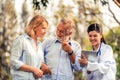 Senior couple talking to nurse or caregiver. Royalty Free Stock Photo