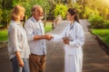 Senior couple talking to nurse or caregiver. Royalty Free Stock Photo