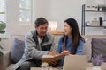 A senior couple in their 60s spends their free time sitting and reading book, relaxing and having fun together on the Royalty Free Stock Photo