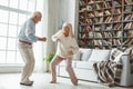 Senior couple together at home retirement concept dancing active dance playful Royalty Free Stock Photo