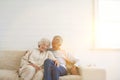 Senior Couple Hugging on Sofa Royalty Free Stock Photo