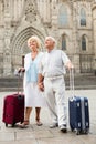 Senior couple of tourists walking around city Royalty Free Stock Photo