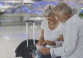 Senior couple traveling airport scene Royalty Free Stock Photo