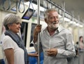 Senior couple traveling inside train subway Concept