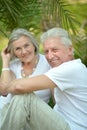 Senior couple at tropic hotel garden Royalty Free Stock Photo