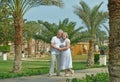 Senior couple at tropic hotel garden Royalty Free Stock Photo