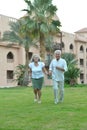 Senior couple at tropic hotel garden Royalty Free Stock Photo