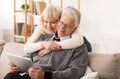 Senior couple using digital tablet, having video call Royalty Free Stock Photo