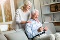 Senior couple using digital tablet at home Royalty Free Stock Photo