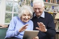 Senior Couple Using Digital Tablet For Video Call With Family Royalty Free Stock Photo