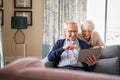 Senior couple using digital tablet for a video call with family Royalty Free Stock Photo