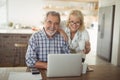 Senior couple using laptop at home Royalty Free Stock Photo