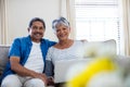 Senior couple using laptop in living room at home Royalty Free Stock Photo