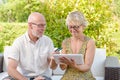 Senior couple using tablet to make a purchase Royalty Free Stock Photo